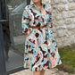 Farbenfrohes Kleid mit 3/4-Ärmeln und Vintage-Blumendruck und Taschen