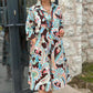 Farbenfrohes Kleid mit 3/4-Ärmeln und Vintage-Blumendruck und Taschen