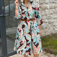 Farbenfrohes Kleid mit 3/4-Ärmeln und Vintage-Blumendruck und Taschen
